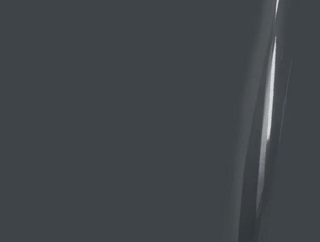 Close-up of a sword blade with a dark background