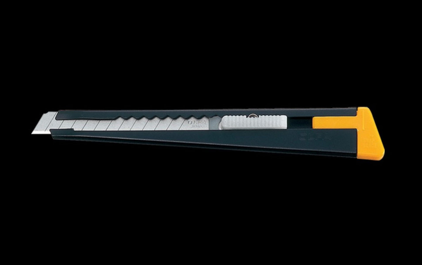 Retractable blade on a black background