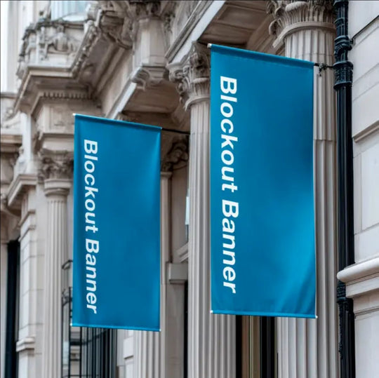 Two blue blockout banners hanging from a building facade.