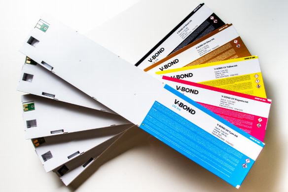 Collection of V-Bond adhesive tapes in various colors on a white background
