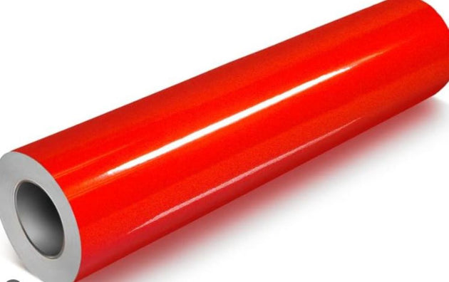 Roll of red vinyl wrap on a white background