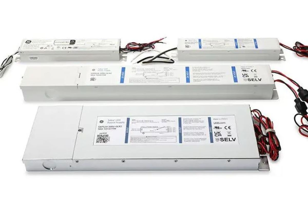 Three LED light bars with wiring on a white background