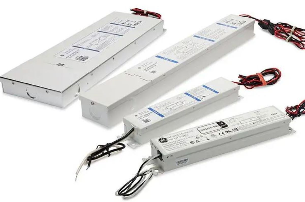 Four electronic power supplies with visible branding on a white background