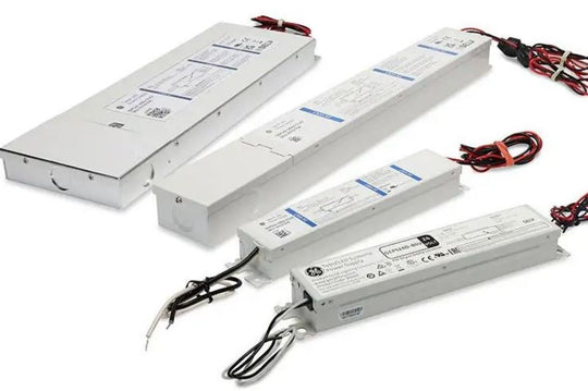 Four electronic power supplies with visible branding on a white background