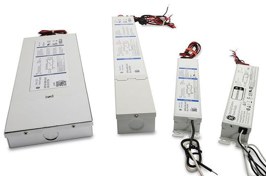 Four electronic power supplies with labels on a white background