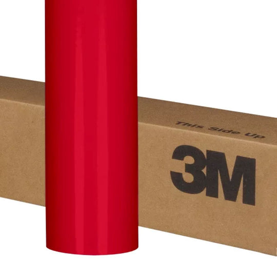 Red vinyl wrap roll with 3M branding on a cardboard box