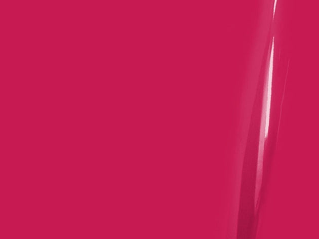 Close-up of a bright pink surface with a subtle reflection.