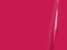 Close-up of a bright pink surface with a subtle reflection.