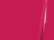 Close-up of a bright pink surface with a subtle reflection.