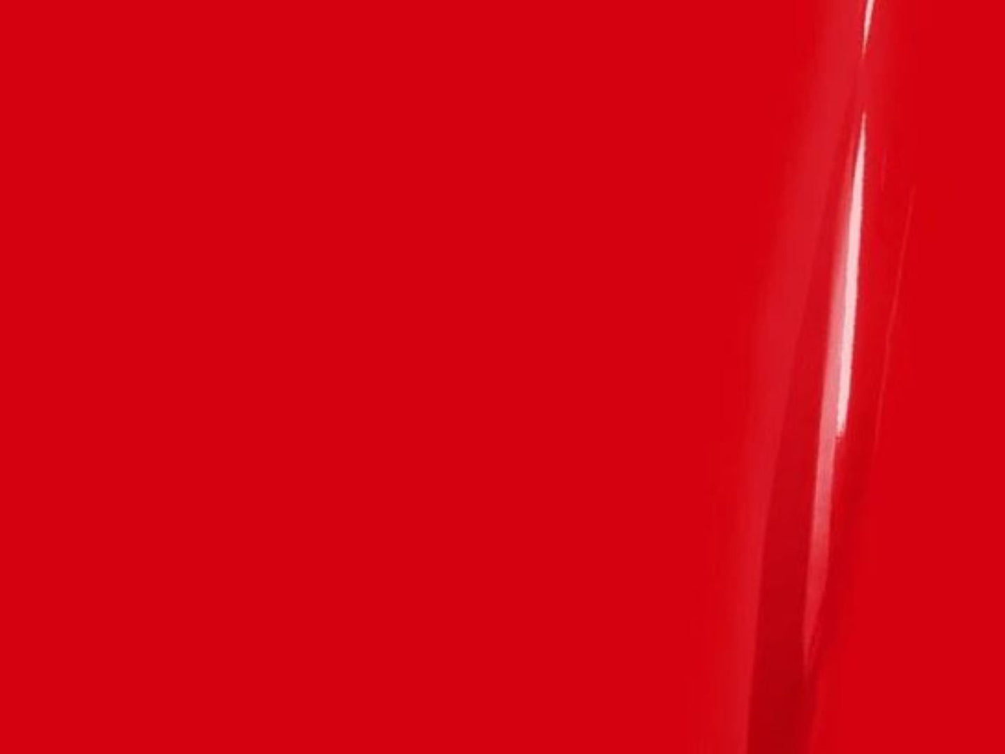 Close-up of a red surface with a glossy finish
