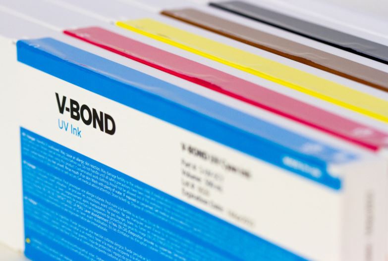 V-Bond UV ink sample set with blue, red, yellow, and silver colors.