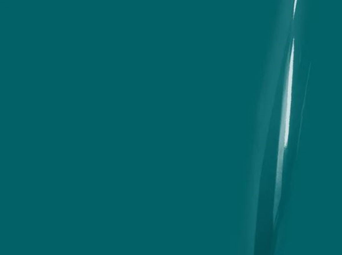Close-up of a teal surface with a reflective line