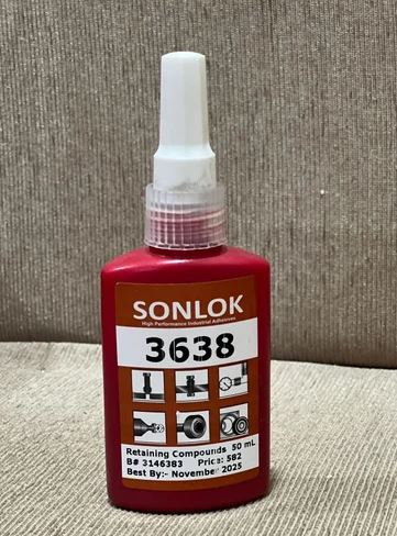 Red Sonlok 3638 adhesive bottle on a textured surface
