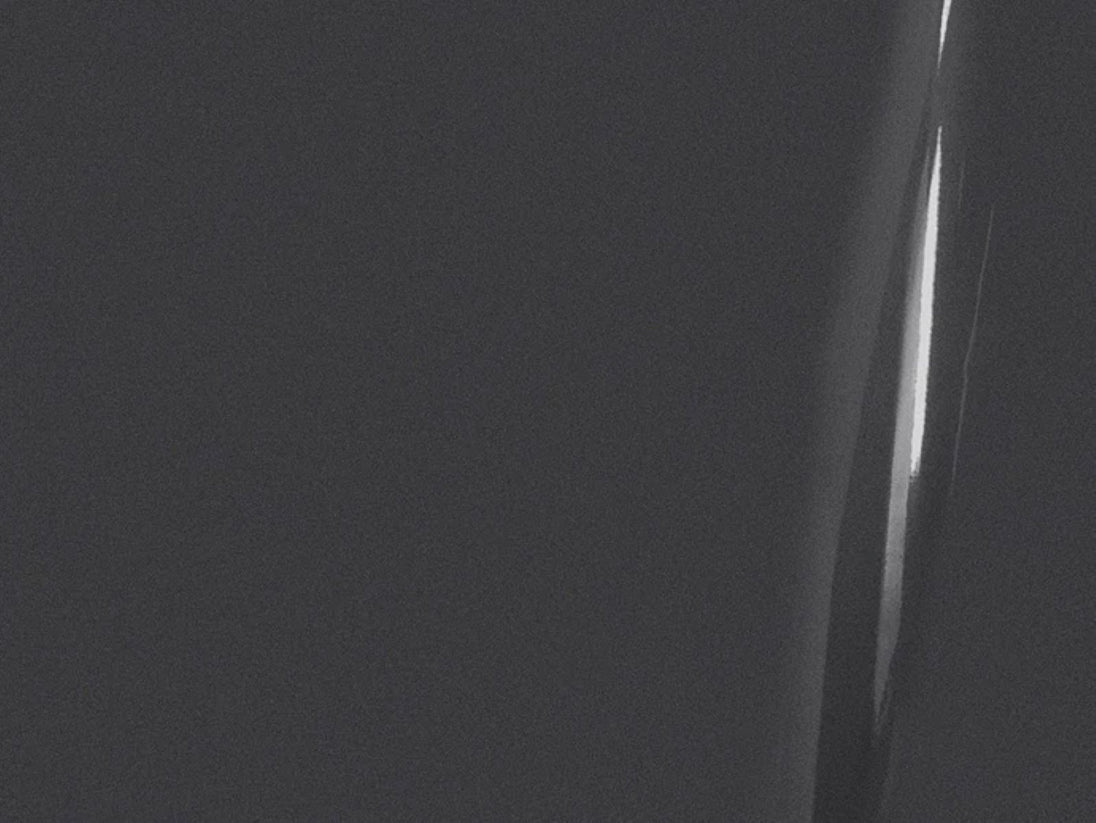 Close-up of a person's knee with a dark background