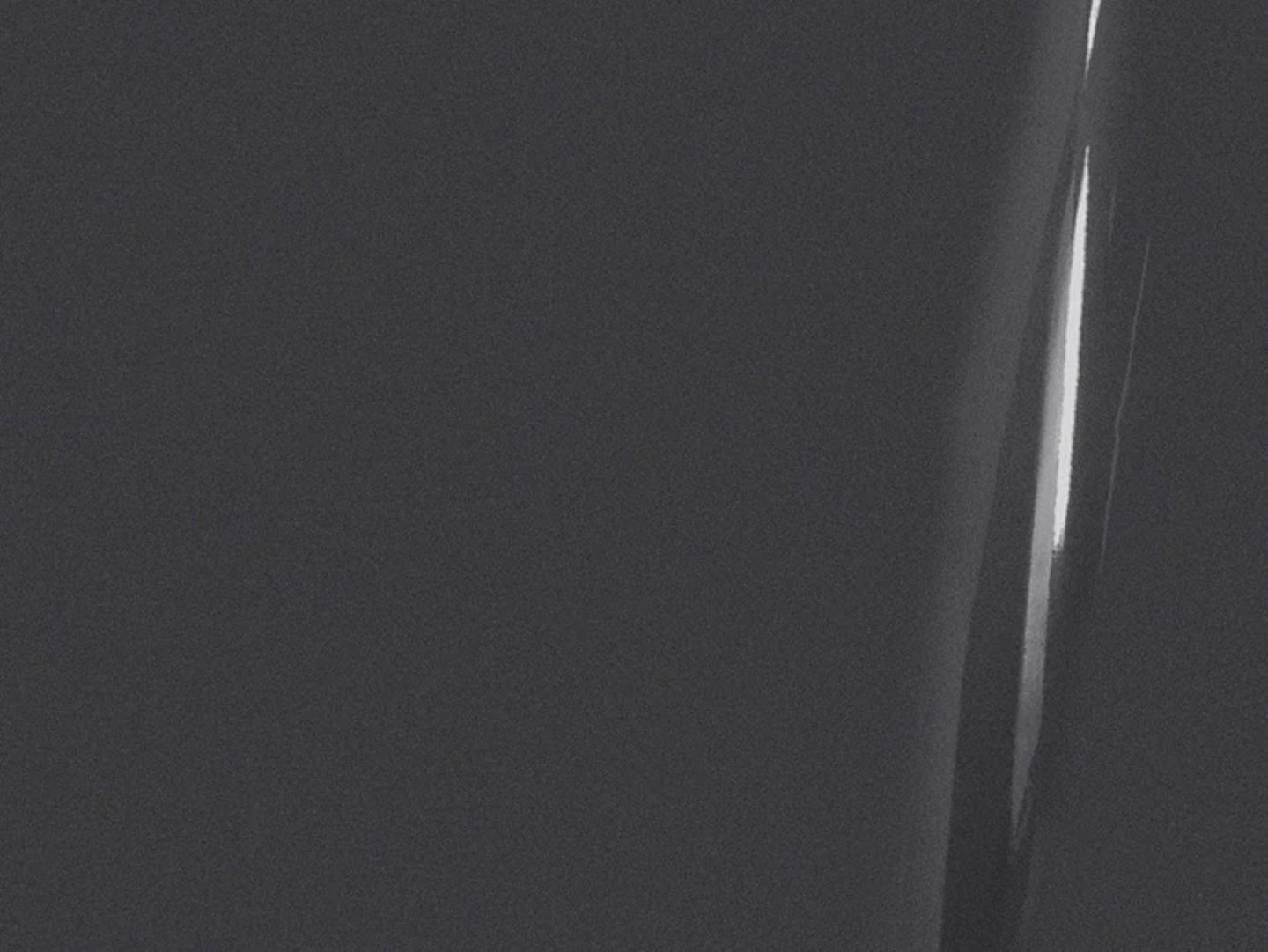 Close-up of a person's knee with a dark background