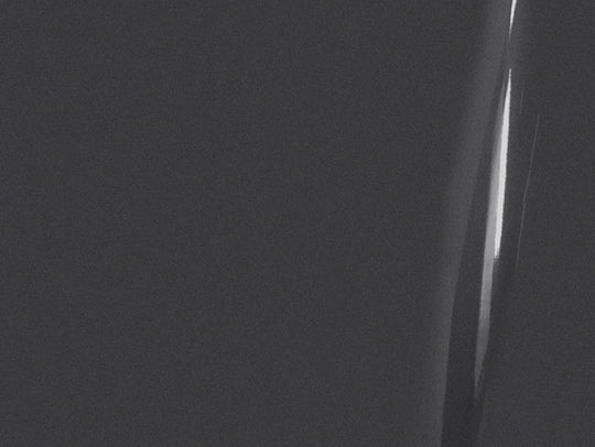 Close-up of a person's knee with a dark background