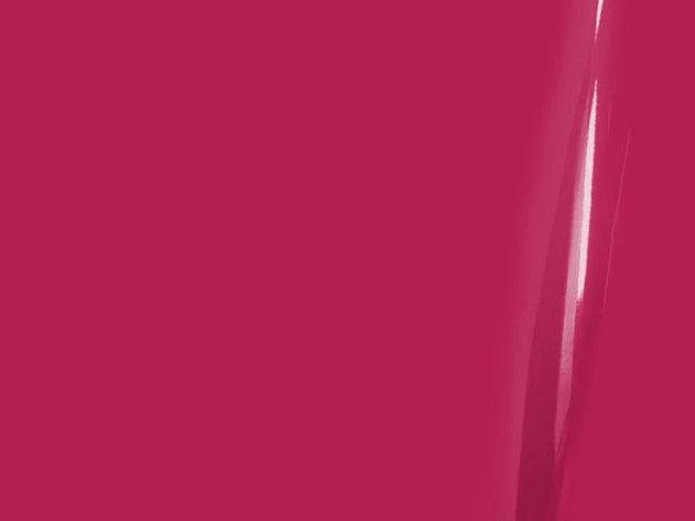 Close-up of a bright pink surface with a glossy finish