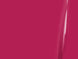 Close-up of a bright pink surface with a glossy finish