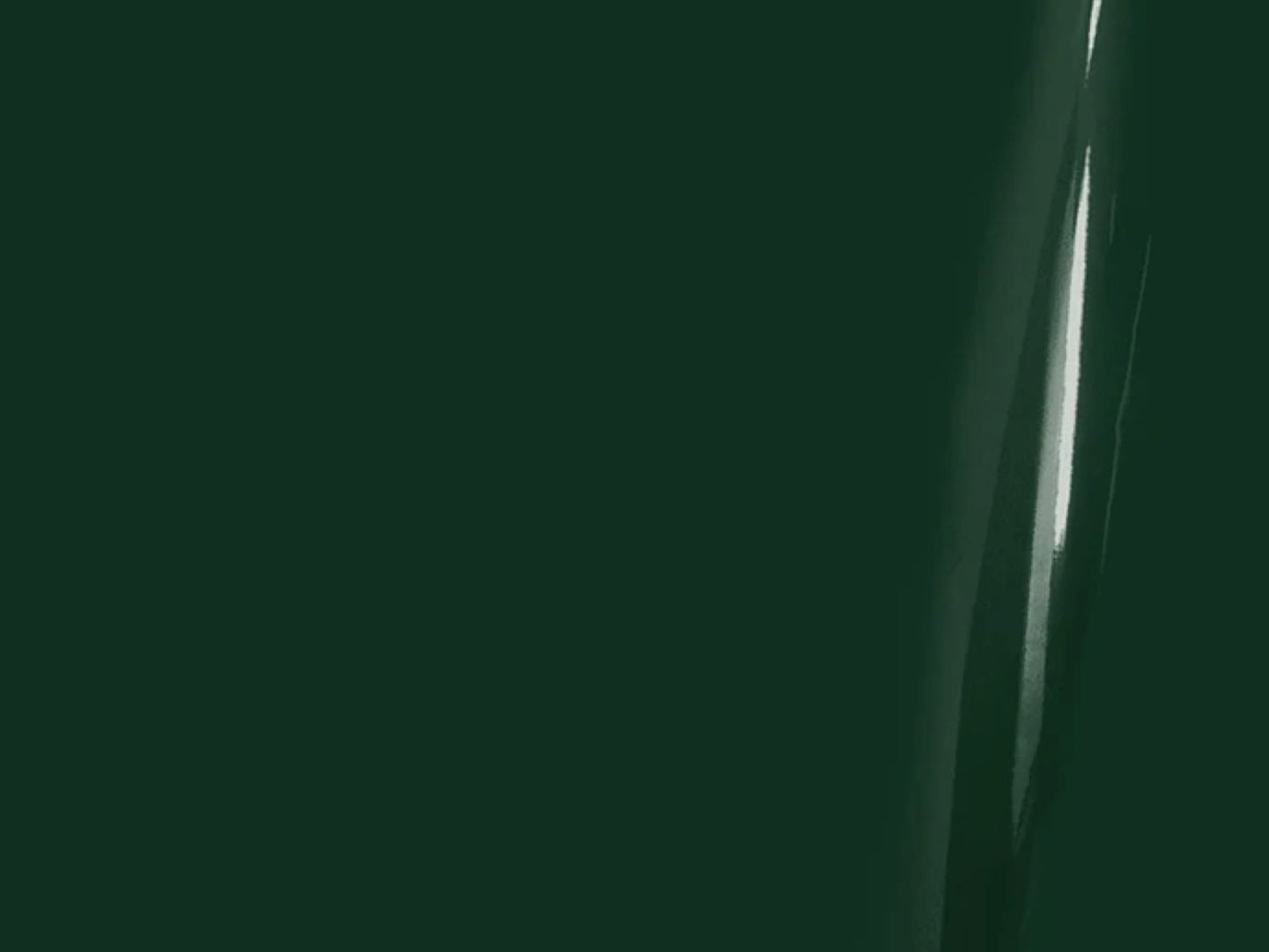 Dark green background with a metallic object on the right side