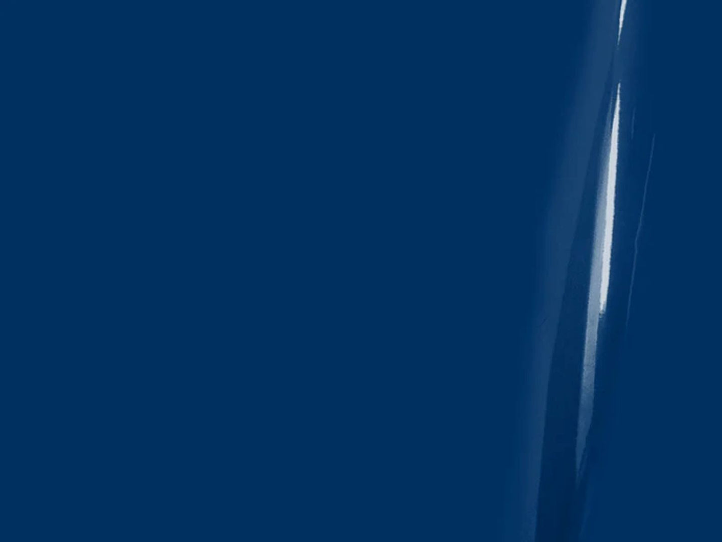 Close-up of a sword blade with a dark background