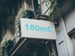 Building facade with a sign displaying '180mC'