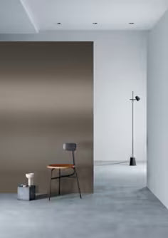 Modern interior with a chair against a wall in a minimalistic setting
