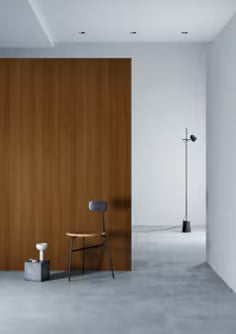 Modern interior with a wooden panel wall, chair, and floor lamp.