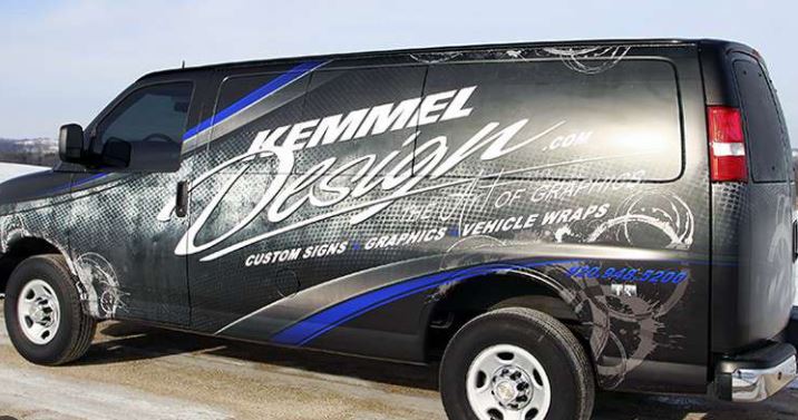 Van with Kemmel Design vehicle wrap on a road