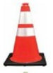 Orange traffic cone with reflective tape on a black background