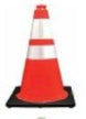 Orange traffic cone with reflective tape on a black background