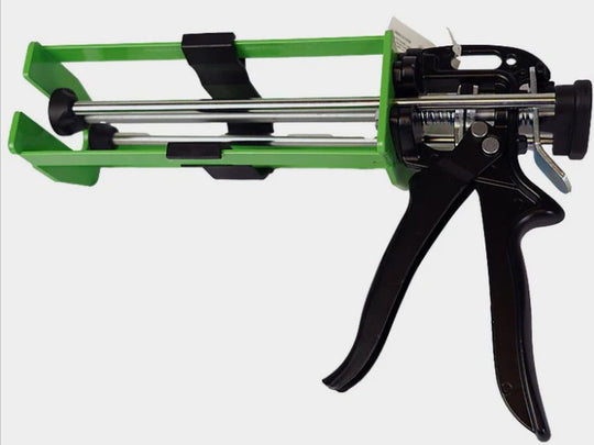 Caulking gun with green and black design on a white background