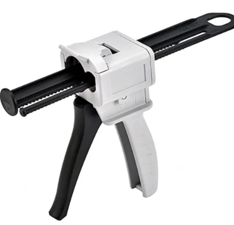 White and black caulking gun on a white background