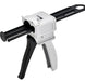 White and black caulking gun on a white background