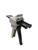 Caulking gun with black and gray design on a white background