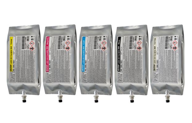 Five silver ink cartridges with labels on a white background