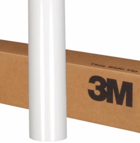 Roll of 3M vinyl wrap on a cardboard box with 'This Side Up' text.