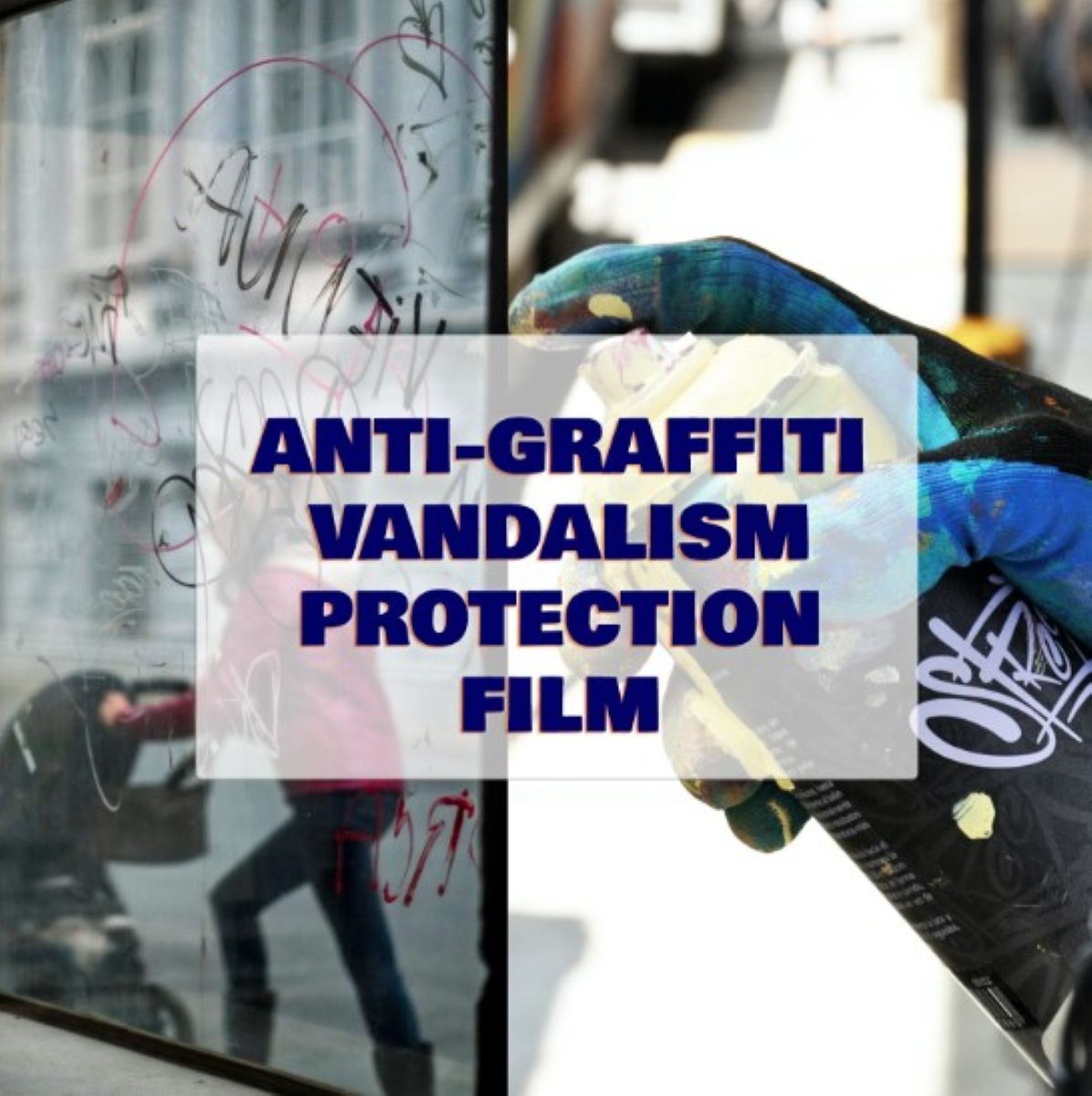 Person applying anti-graffiti vandalism protection film on a glass surface.