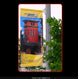 Banner with a red building design and 'Downtown Guild' text on a pole with greenery.
