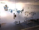 Glass wall with decorative cow illustrations and 'BOARD' branding.