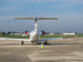 Small airplane on a runway with clear sky