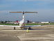 Small airplane on a runway with clear sky