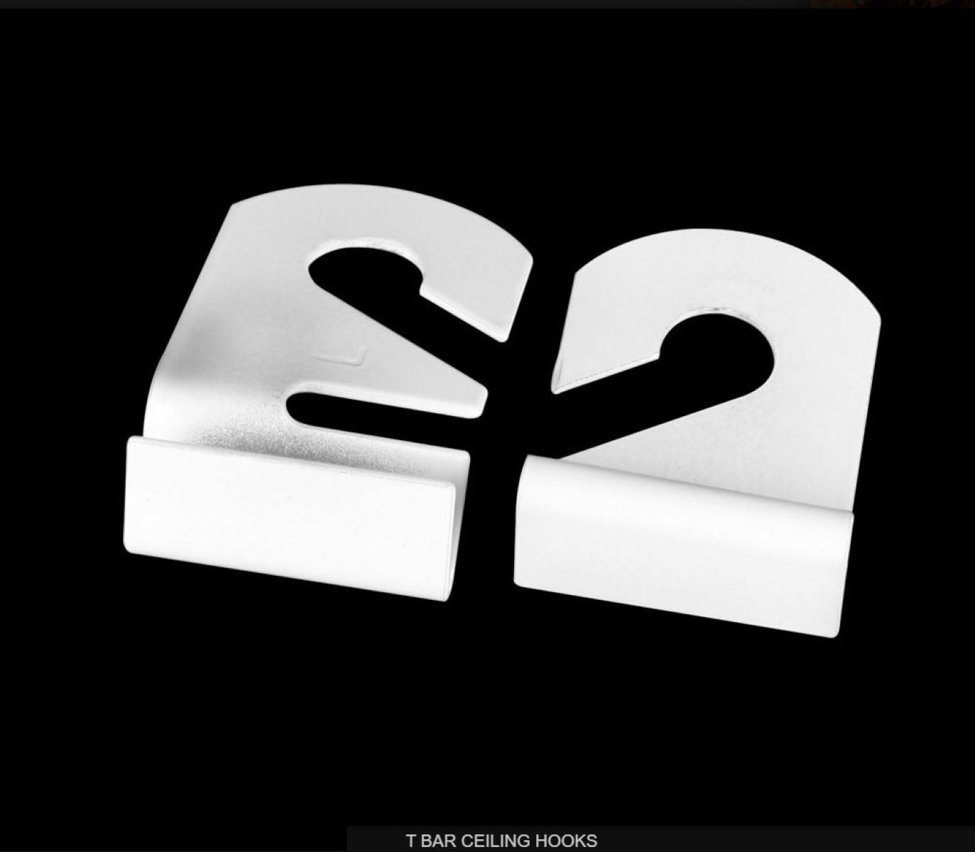 Metallic T-bar ceiling hook on a black background