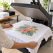 Illustrative application example: positioning a masked apparel transfer at an open heat press