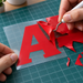 Illustrative HTV weeding workflow with a hook tool and clear carrier