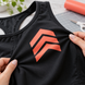 AI application illustration: coral cut-film chevrons on black stretch apparel; representative finish and color.