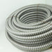 Coiled metal hose on a white background