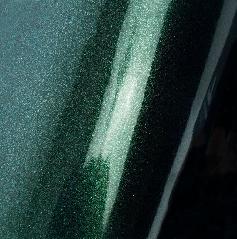Lumina 2100 Dark Green Metallic material color reference; appearance varies with lighting and screen settings.