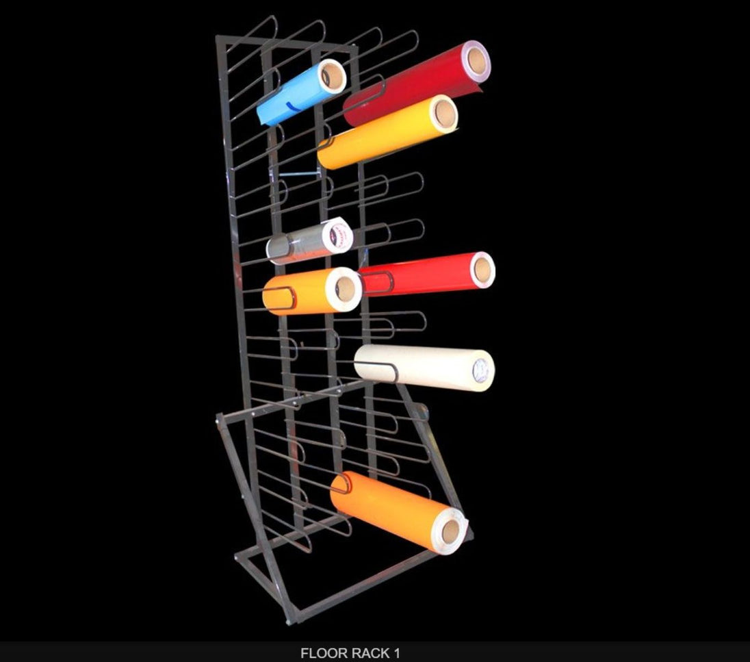 Colorful rolls of paper on a metal floor rack against a black background