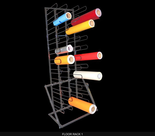 Colorful rolls of paper on a metal floor rack against a black background