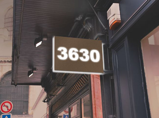 Digital display showing the number '3630' on a building exterior.
